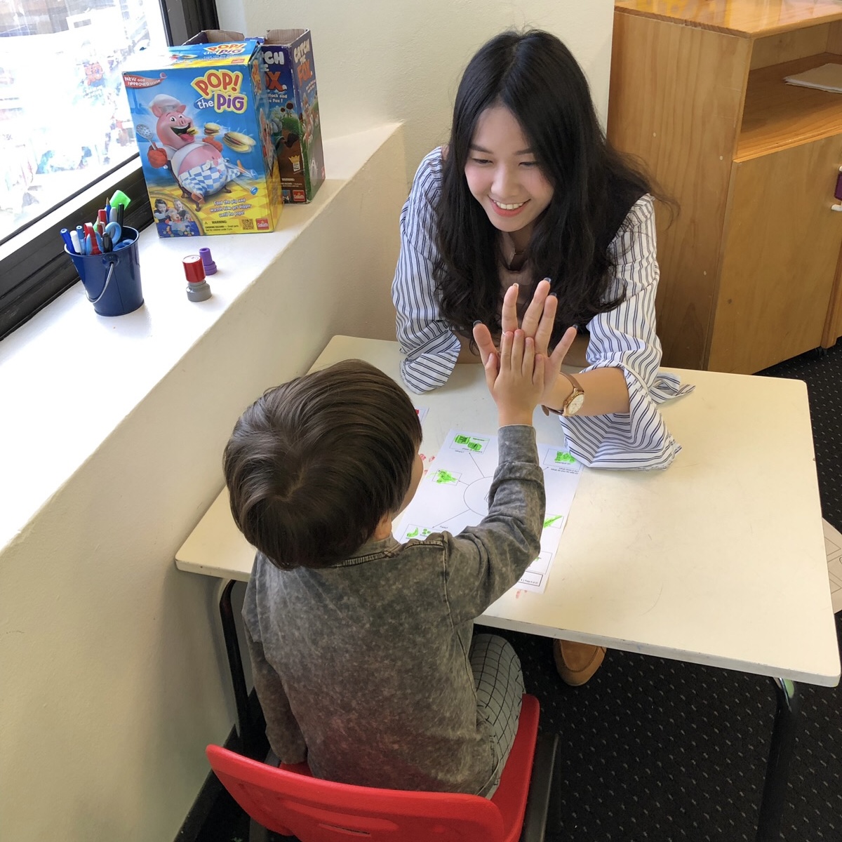 Child learning non verbal communication in ESDM session in Bondi Junction and Mascot