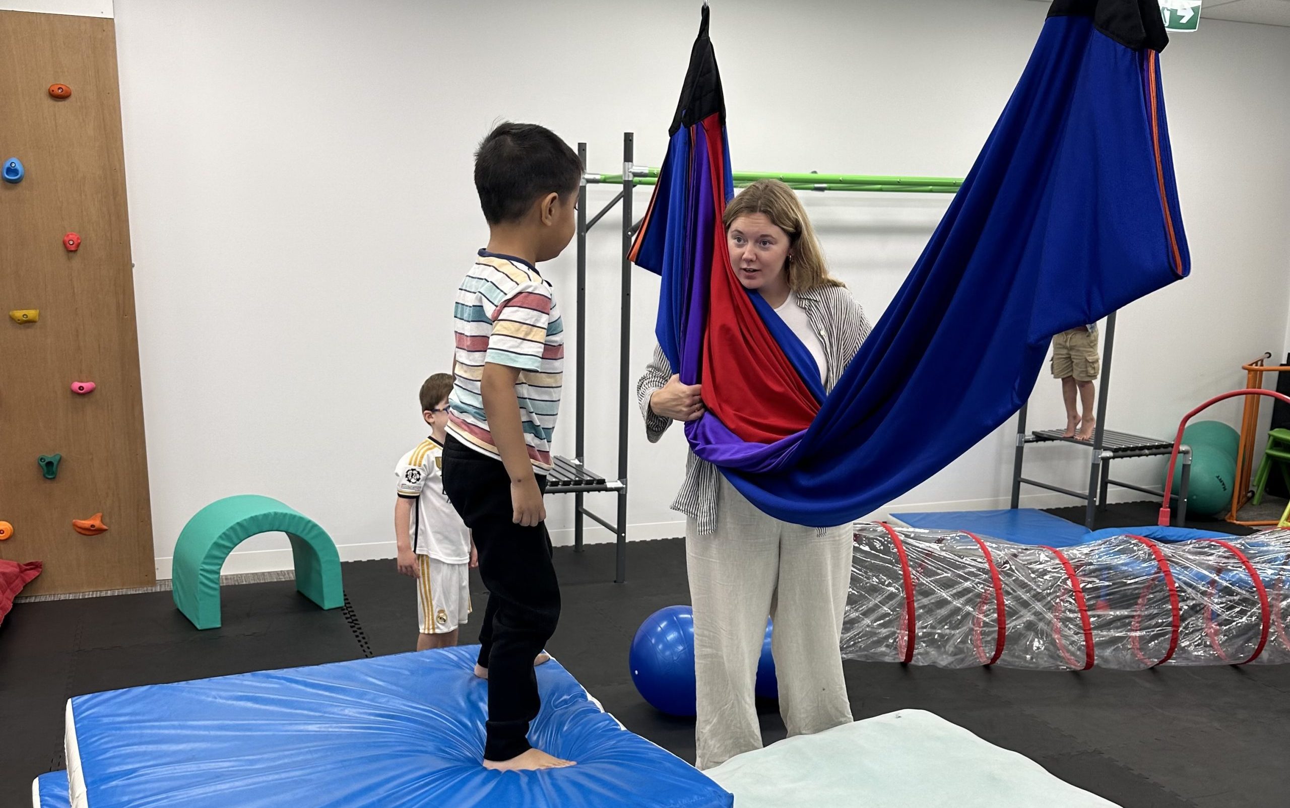 Child with ADHD working on gross motor skills in Occupational Therapy gym in Bondi Junction, Mascot and Randwick.
