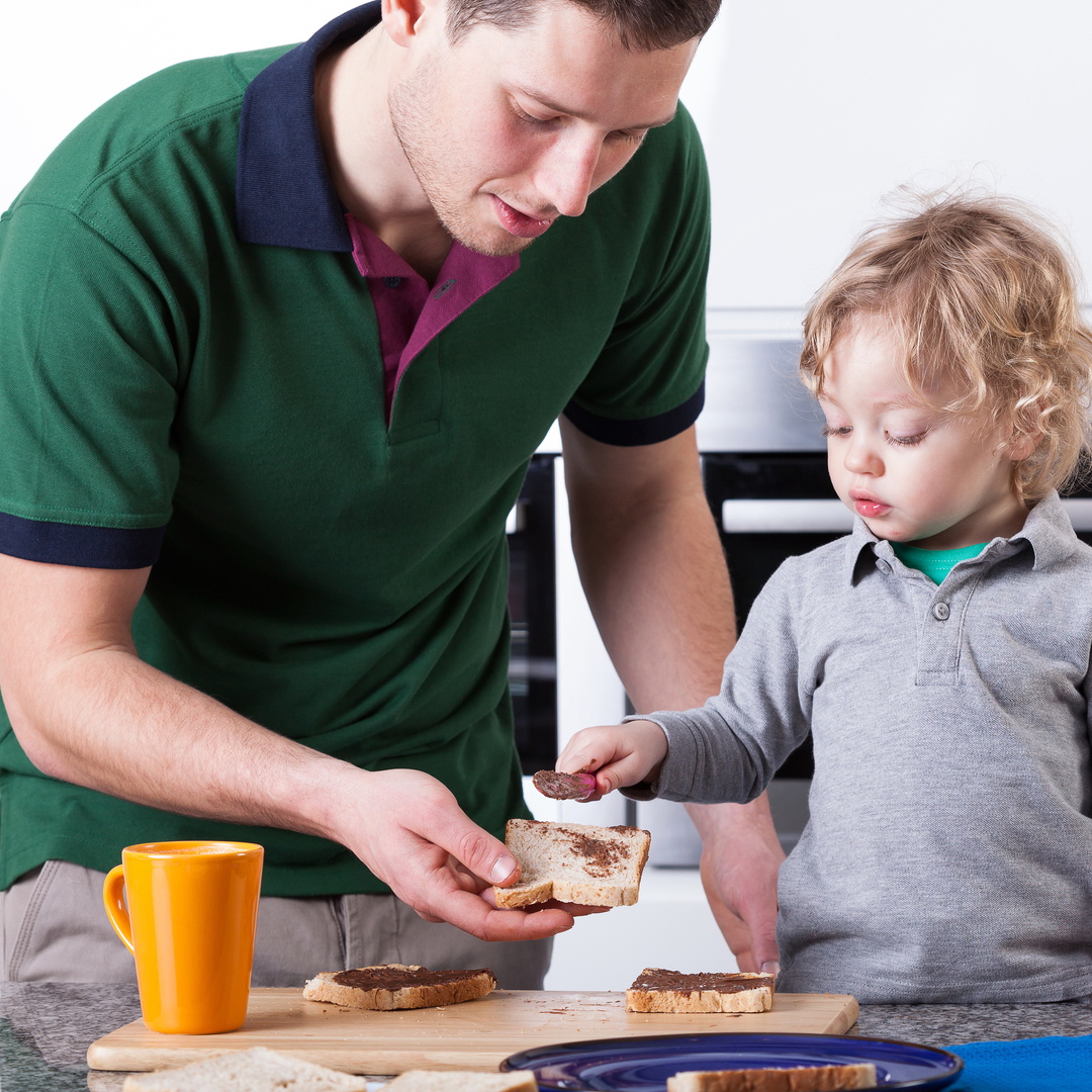 Father preparing food with a fussy eater to reduce mealtime stress in our feeding clinic in Bondi Junction and Mascot.