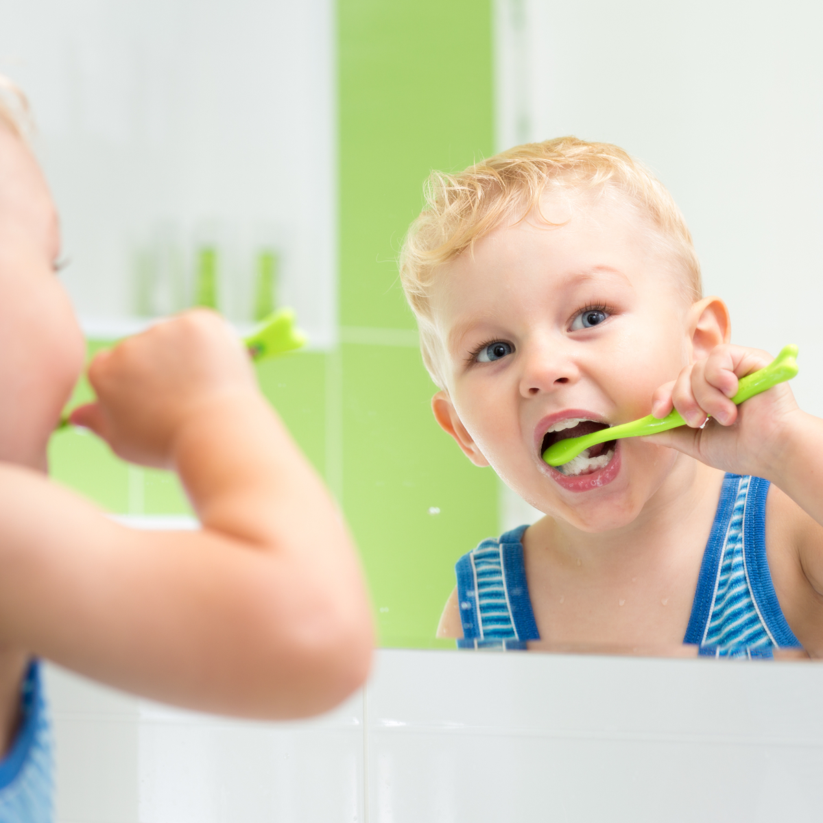 A child with autism learning to tolerate brushing their teeth